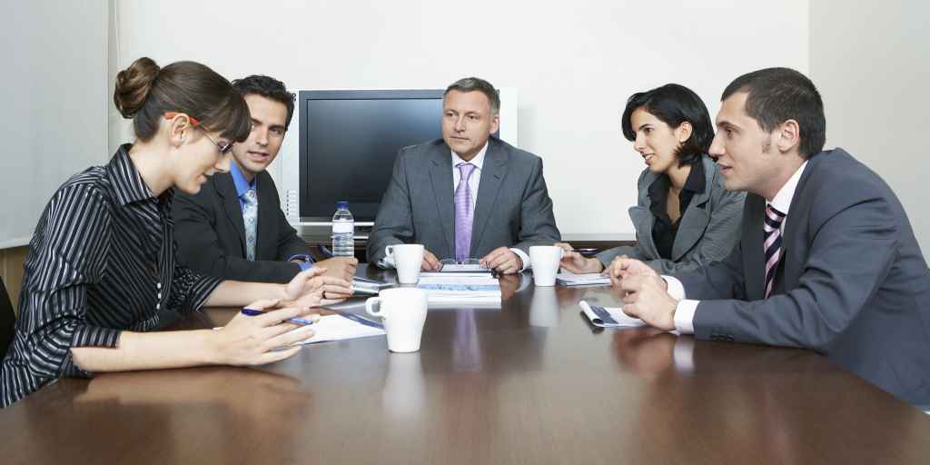 Team Discussing Good and Bad of Last CRM